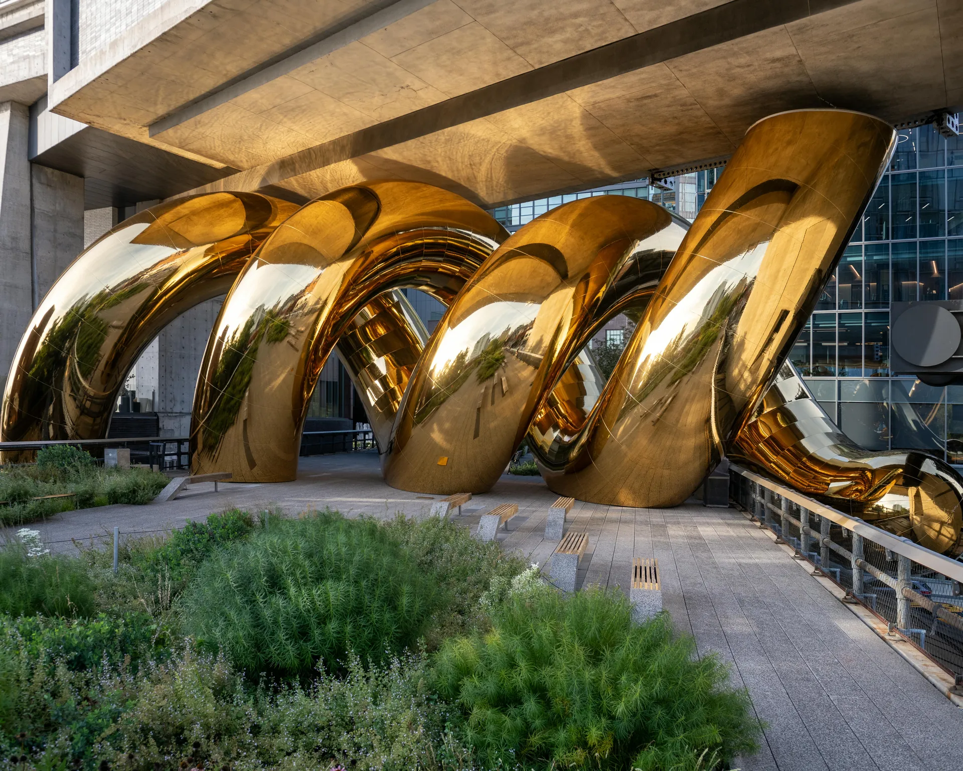 Bulgari Serpenti installation auruBOROS on the High Line in New York: golden coils beneath a building