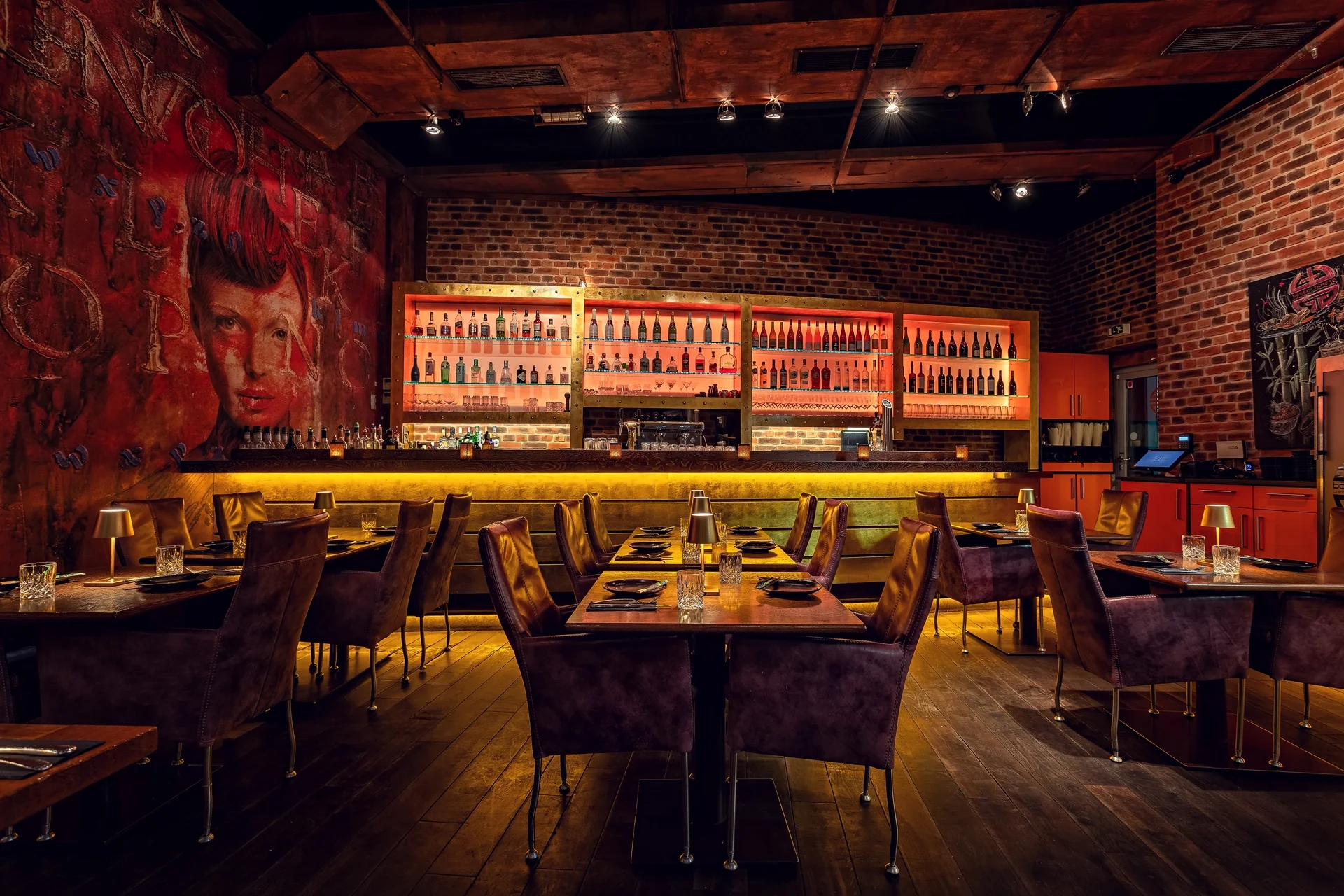 Dining room with a long bar and warm lighting